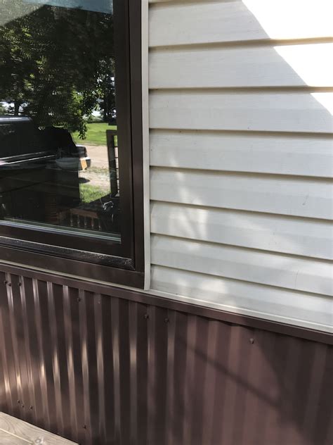 houses with vinyl siding with a metal wainscot|is wainscoting expensive.